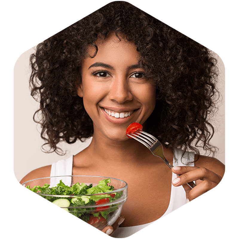 Woman eating salad.